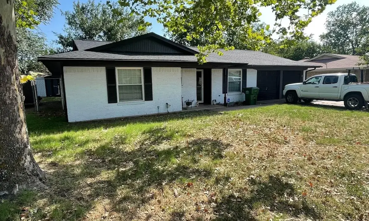 Professional roofing crew working on a residential roof in Dallas